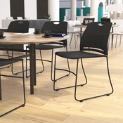 HERCULES Series Commercial Grade 660 lb. Capacity Black Plastic Stack Chair with Black Powder Coated Sled Base Frame and Integrated Carrying Handle, RUT-NC499A-BK-GG