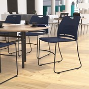 HERCULES Series Commercial Grade 660 lb. Capacity Navy Plastic Stack Chair with Black Powder Coated Sled Base Frame and Integrated Carrying Handle, RUT-NC499A-NAVY-GG
