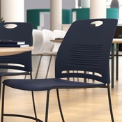 HERCULES Series Commercial Grade 660 lb. Capacity Navy Plastic Stack Chair with Black Powder Coated Sled Base Frame and Integrated Carrying Handle, RUT-NC499A-NAVY-GG